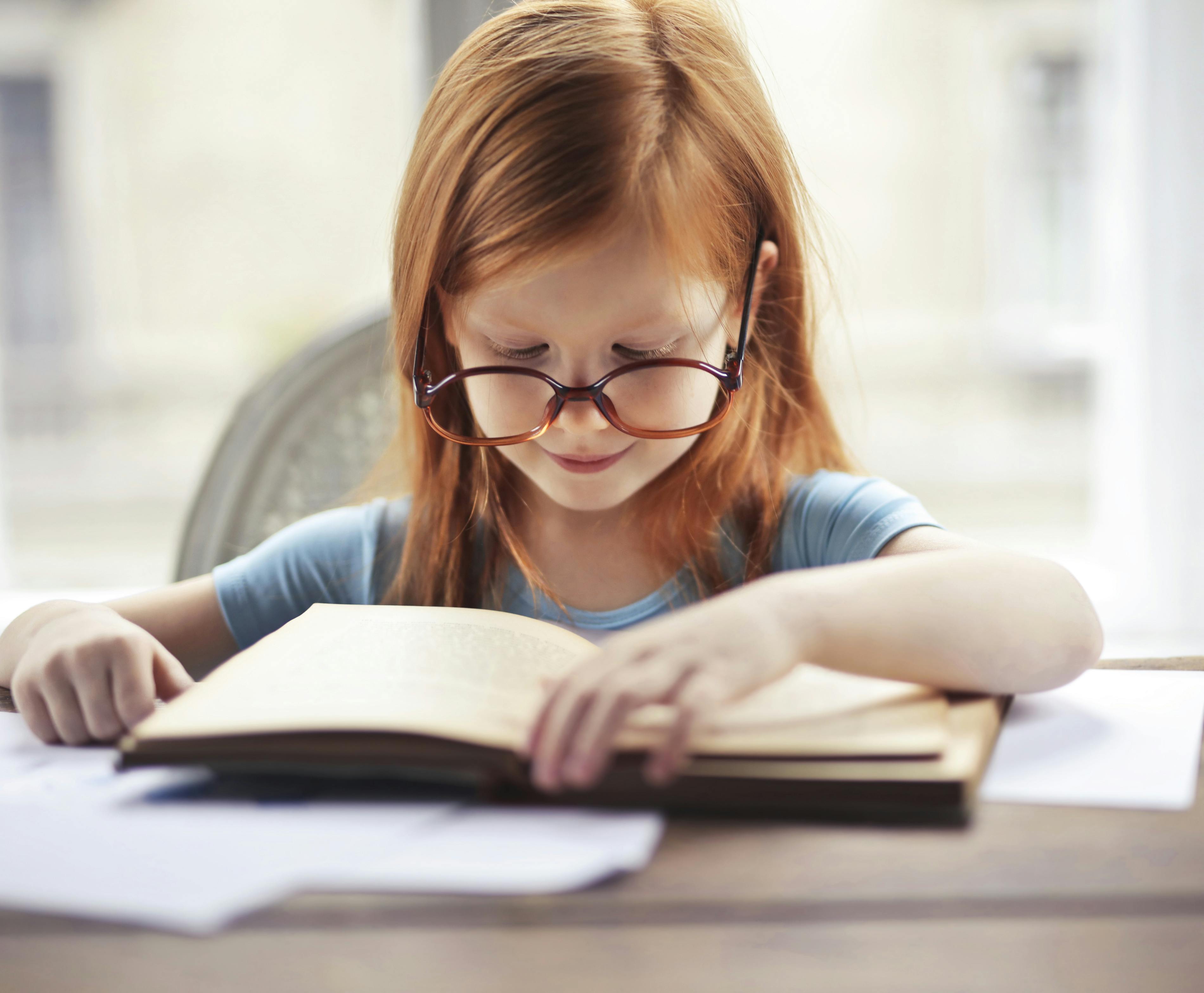 NT child reading a book pexels olly 3768122